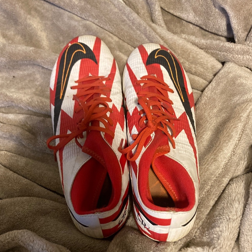 Nike Red and White Womens Cleats, slight wear, still firm and tightly fit.